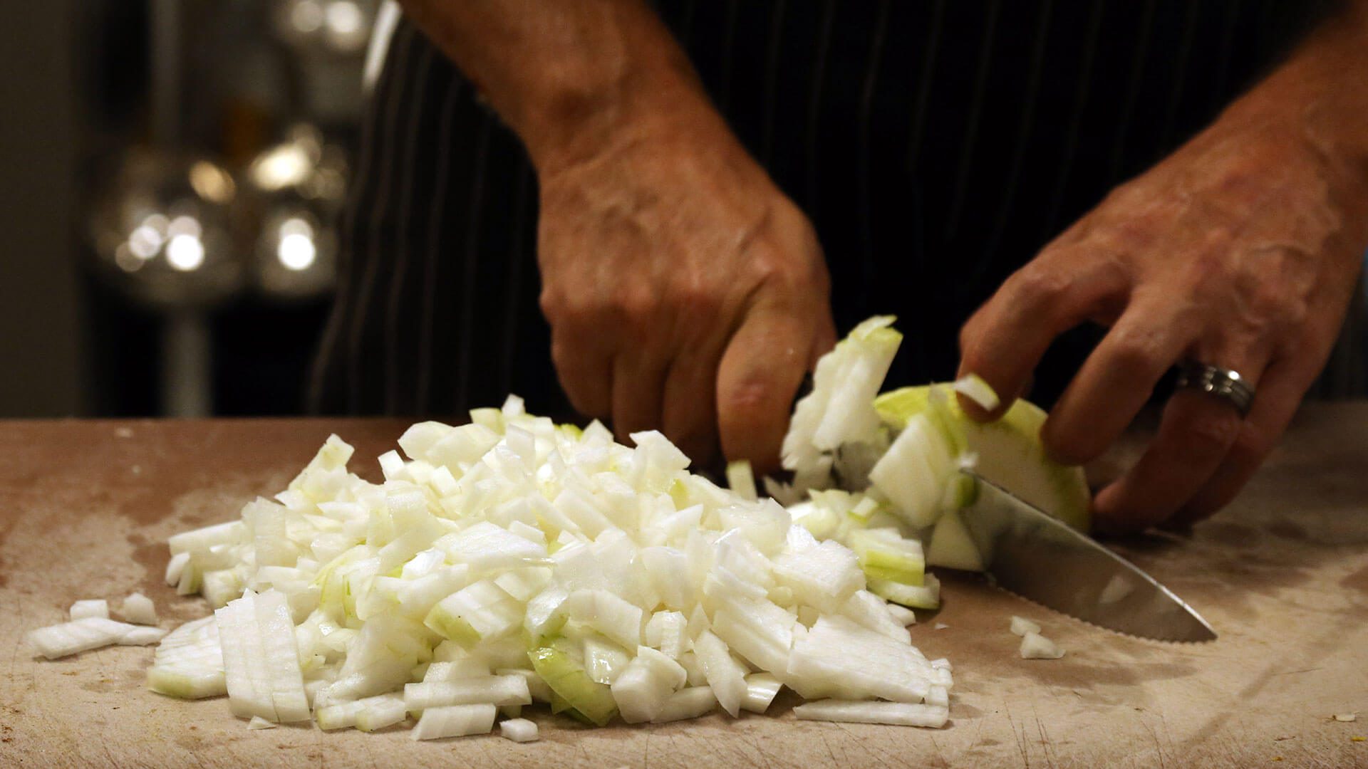 Man chopping onions